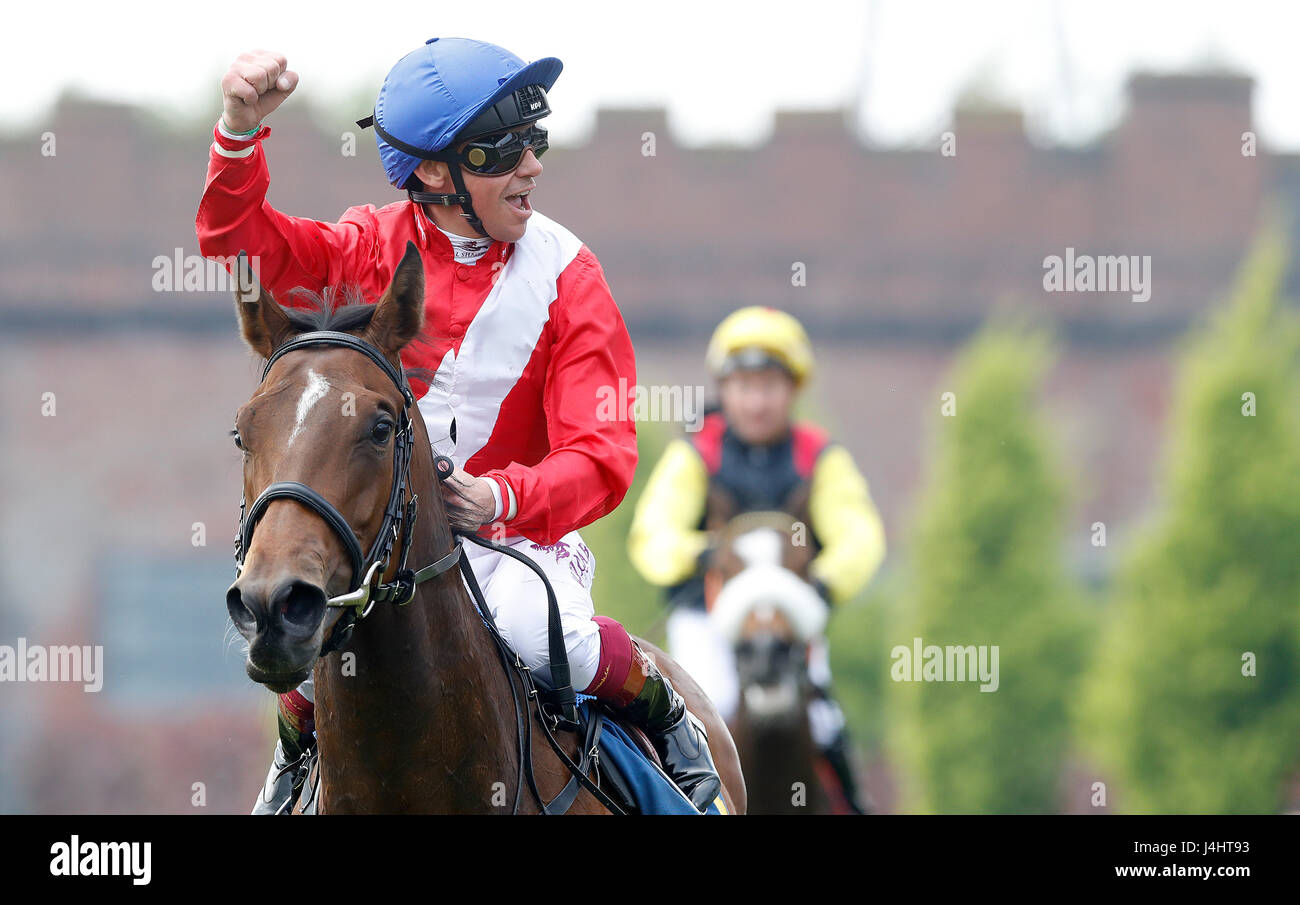 Frankie Dettori celebrates on Gymnaste after winning The TMT Group Maiden Fillies Stakes, during day three of the Chester May Festival. Stock Photo