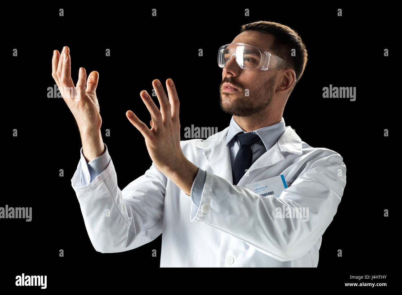 doctor or scientist in lab coat and safety glasses Stock Photo Alamy