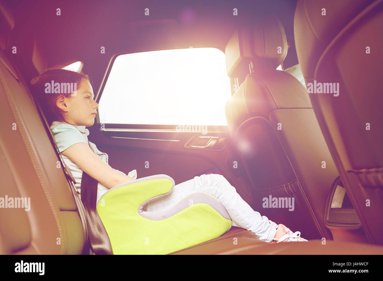 family with child in safety seat driving car Stock Photo Alamy
