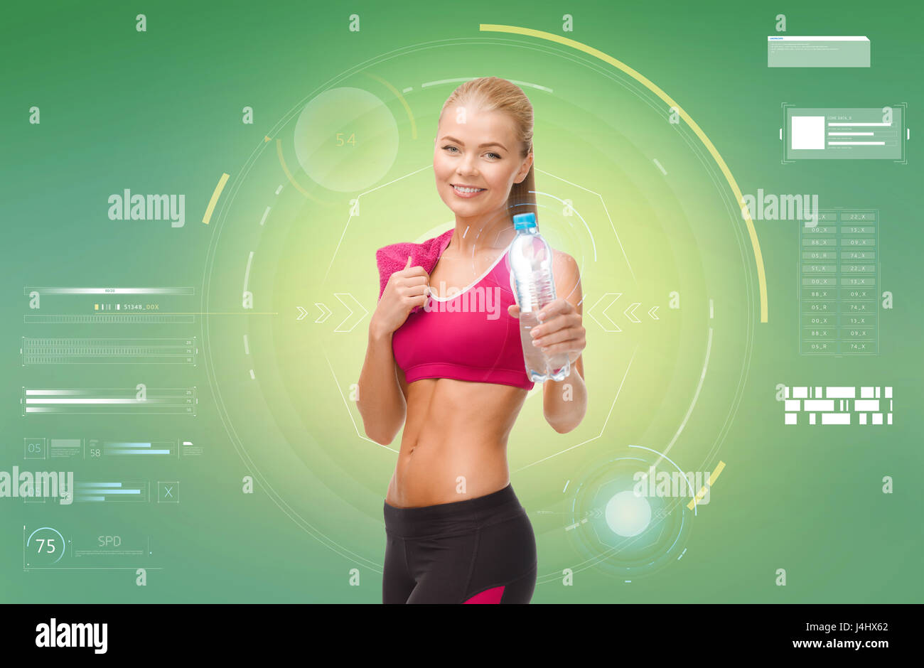 sporty woman with bottle of water and towel Stock Photo - Alamy
