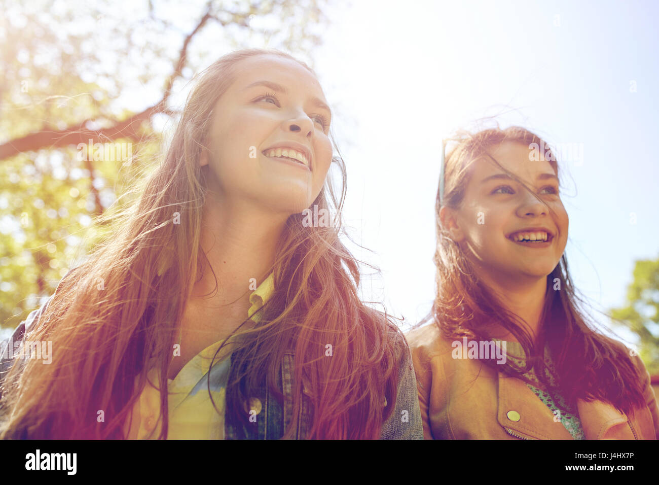 happy teenage student girls or friends outdoors Stock Photo - Alamy