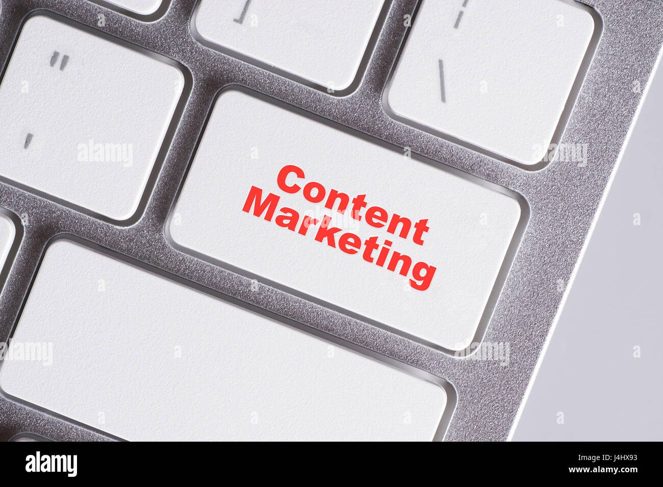 'Content Marketing' red words on white keyboard - online, education and business concept Stock Photo