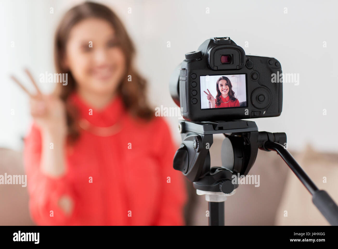 woman with camera recording video at home Stock Photo Alamy