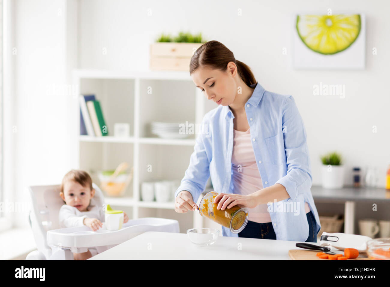 mother with blender cooking baby food at home Stock Photo Alamy