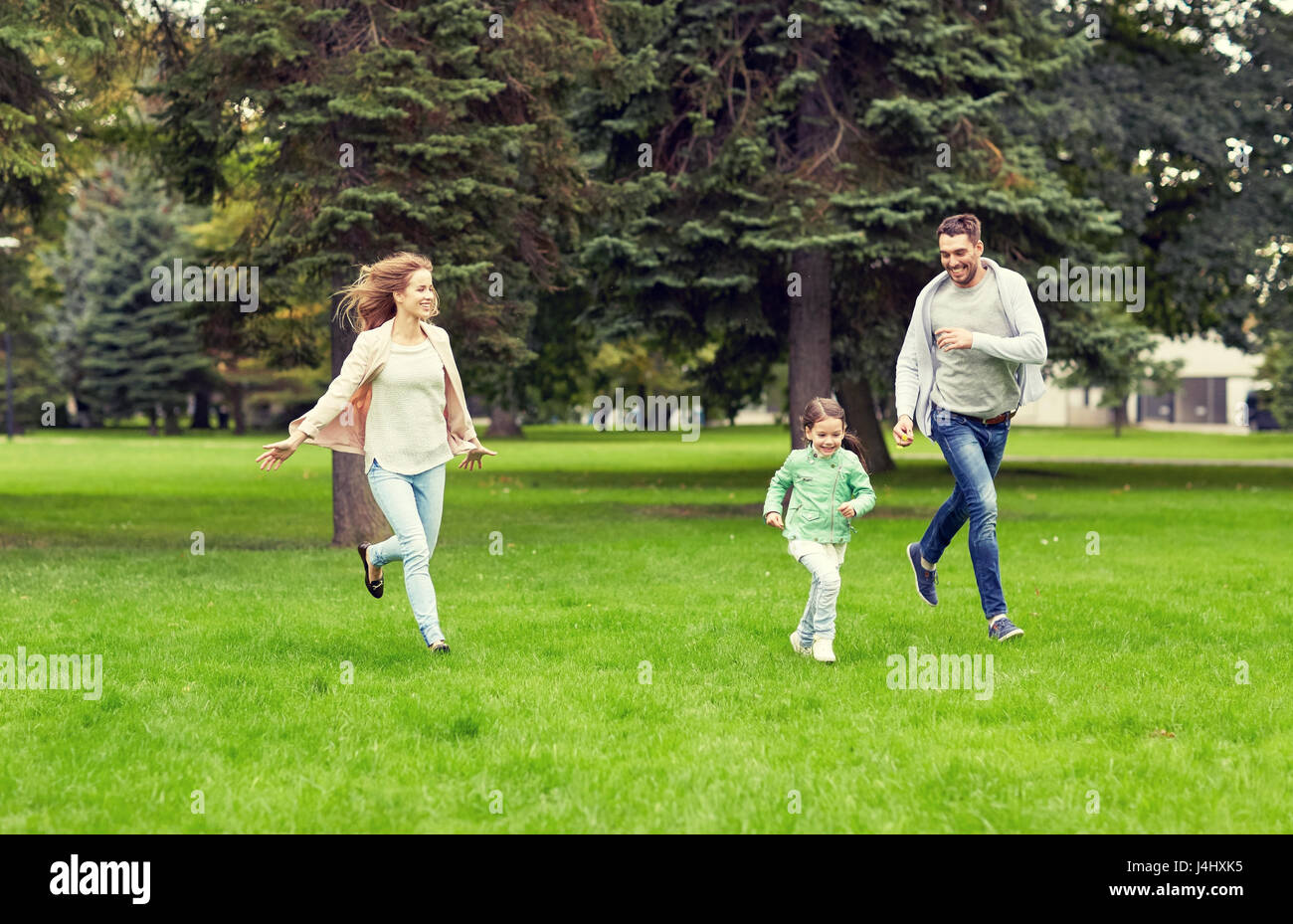 happy family walking in summer park Stock Photo - Alamy