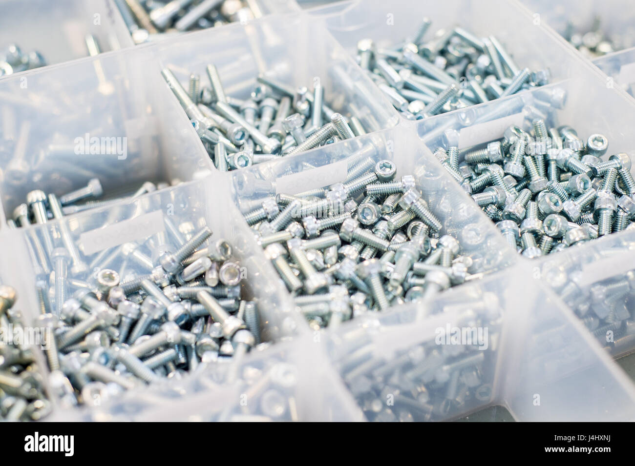 Stock of different sizes of bolts with Allen key fittings Stock Photo