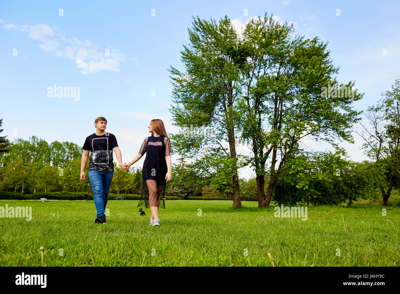 A loving couple walks in the park Stock Photo - Alamy