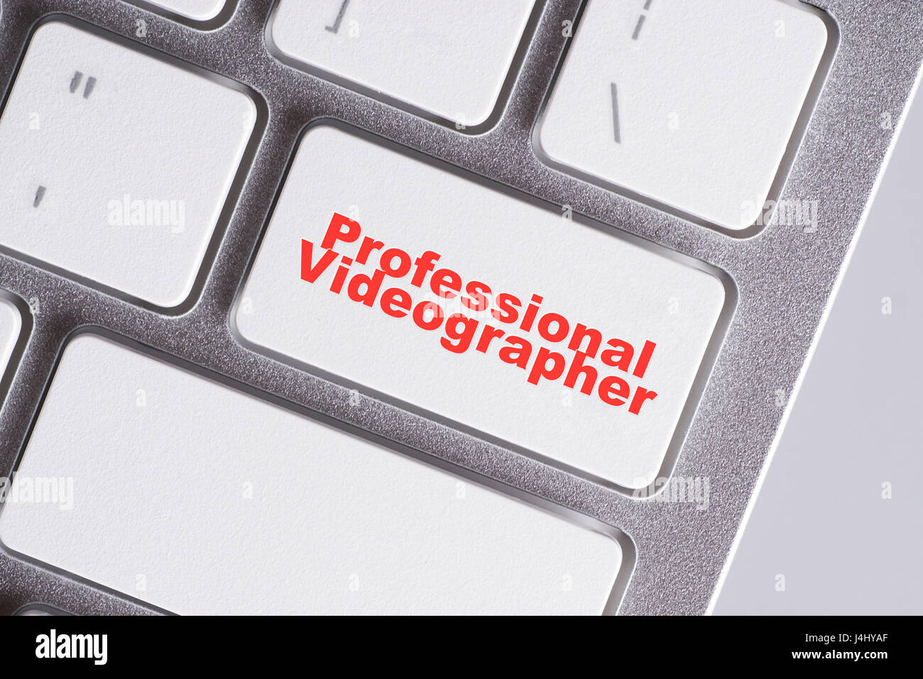 "Profesional videographer" red words on white keyboard online