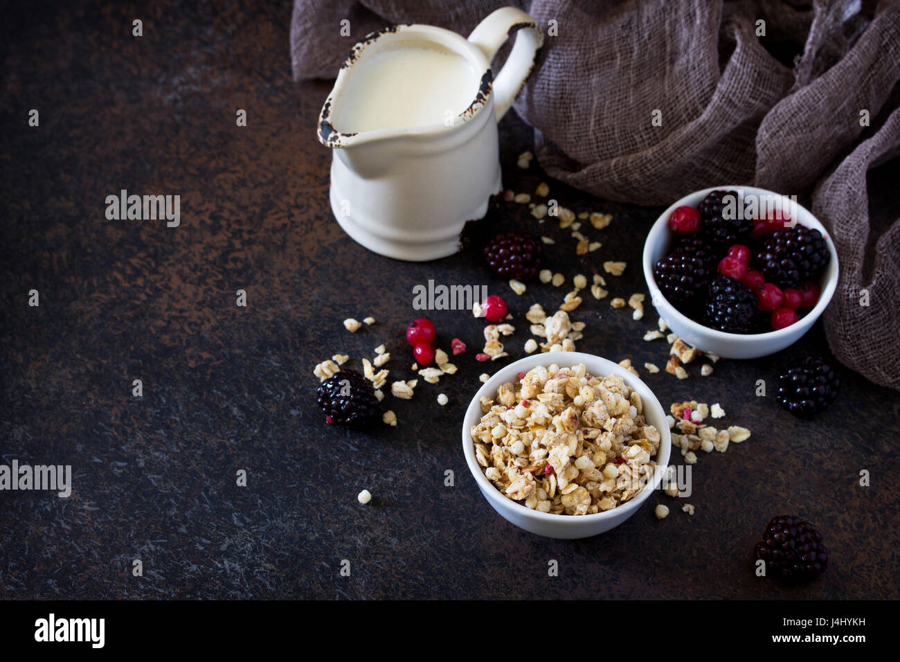 Healthy ingredients for breakfast. Homemade granola with fresh berries and yogurt Stock Photo