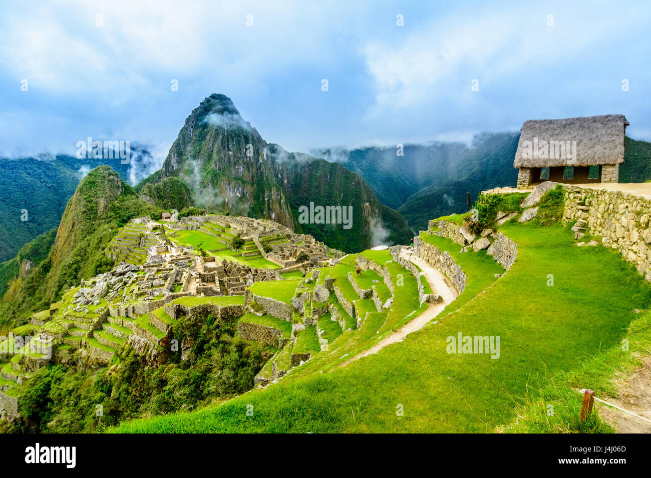 Overview of Machu Picchu, Guard house, agriculture terraces, Wayna Picchu and surrounding mountains in the background Stock Photo