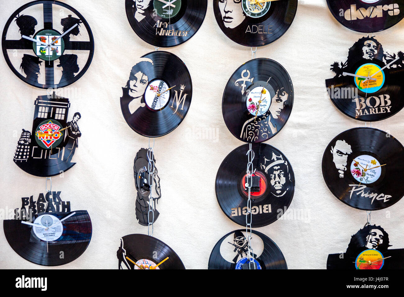 Laser-cut vinyl record clocks with famous artists at Spitalfields Market, London, UK Stock Photo