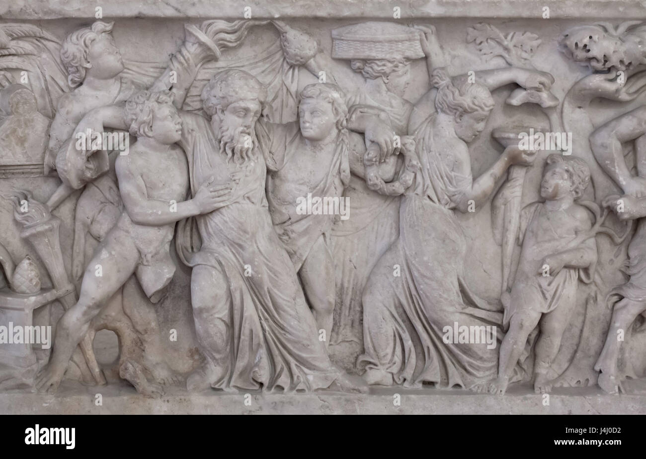 Drunken Dionysus supported by two young satyrs. Detail of the Roman marble sarcophagus with the Dionysian scenes from the Farnese Collection on display in the Secret Cabinet (Gabinetto Segreto) in the National Archaeological Museum in Naples, Campania, Italy. Stock Photo