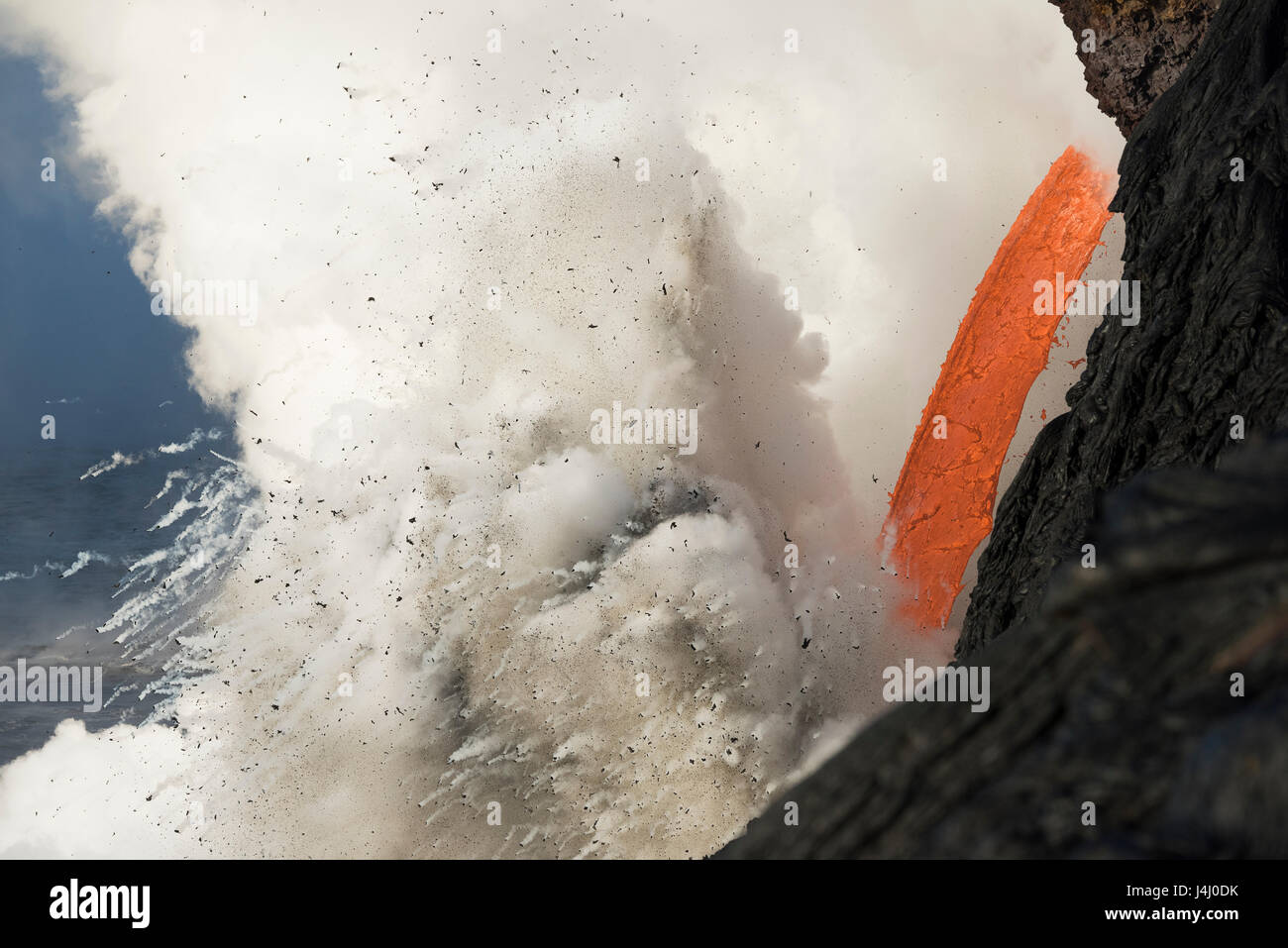 hot lava from from Kilauea Volcano creates steam explosion at Kamokuna ocean entry in Hawaii Volcanoes National Park, Hawaii Island, USA Stock Photo