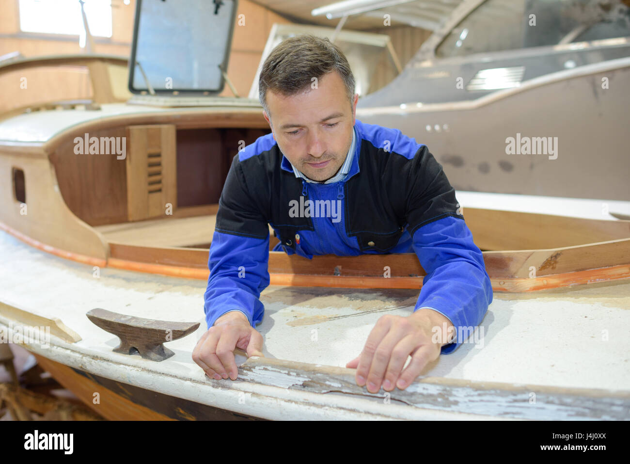 Boat maker at work Stock Photo Alamy