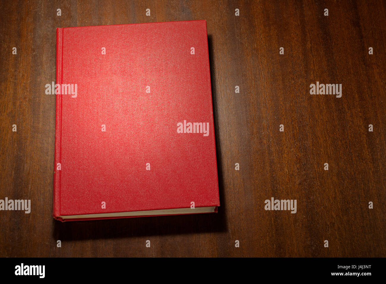 Red book on the table Stock Photo Alamy