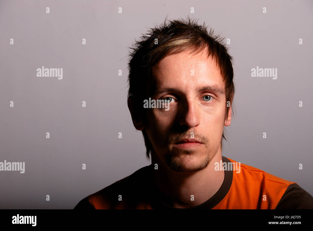 Young man in a studio location - head shot Stock Photo