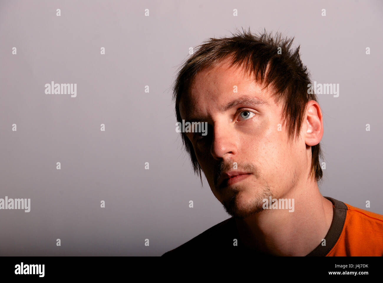Young man in a studio location - head shot Stock Photo