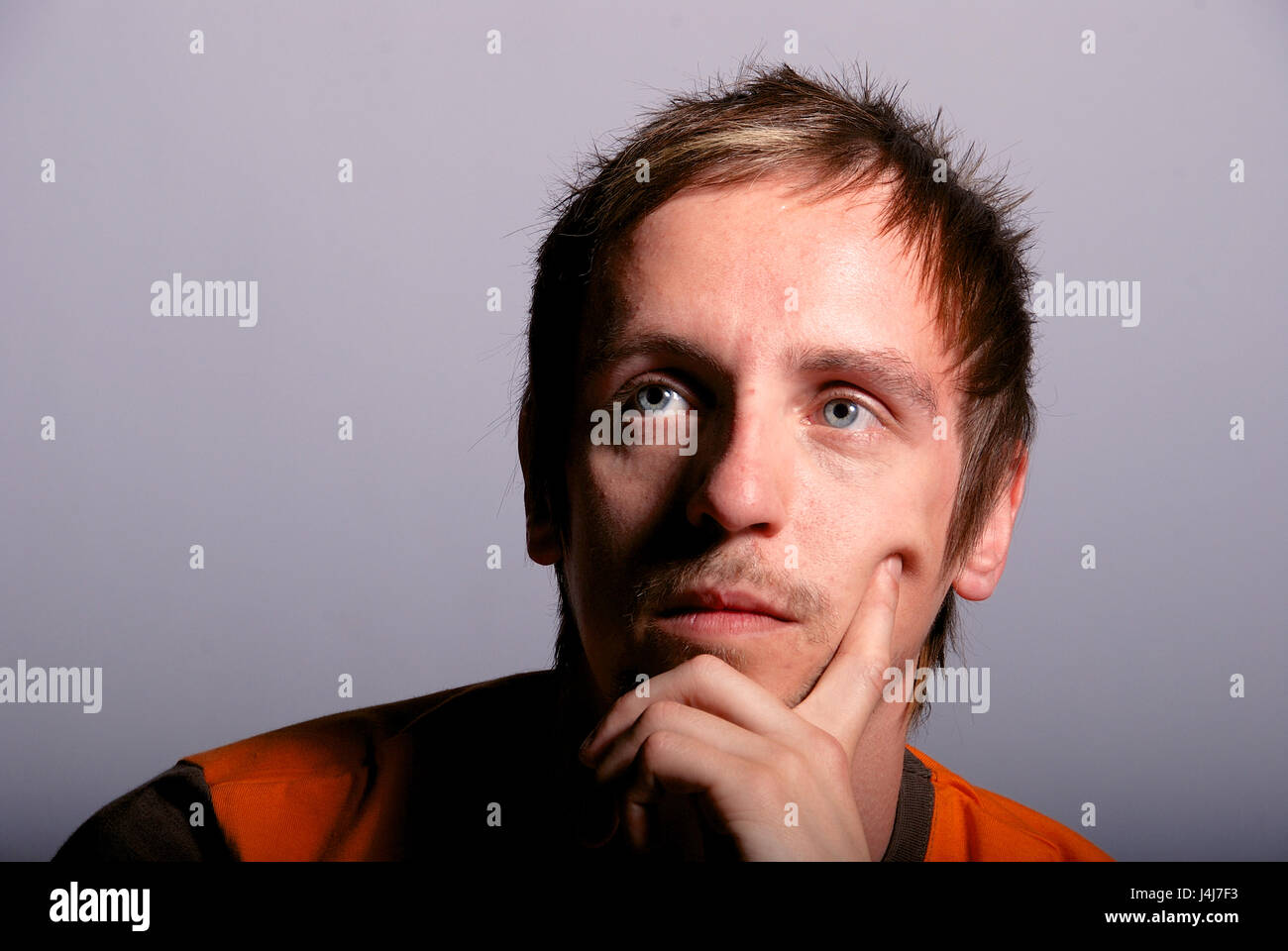 Young man in a studio location - head shot Stock Photo