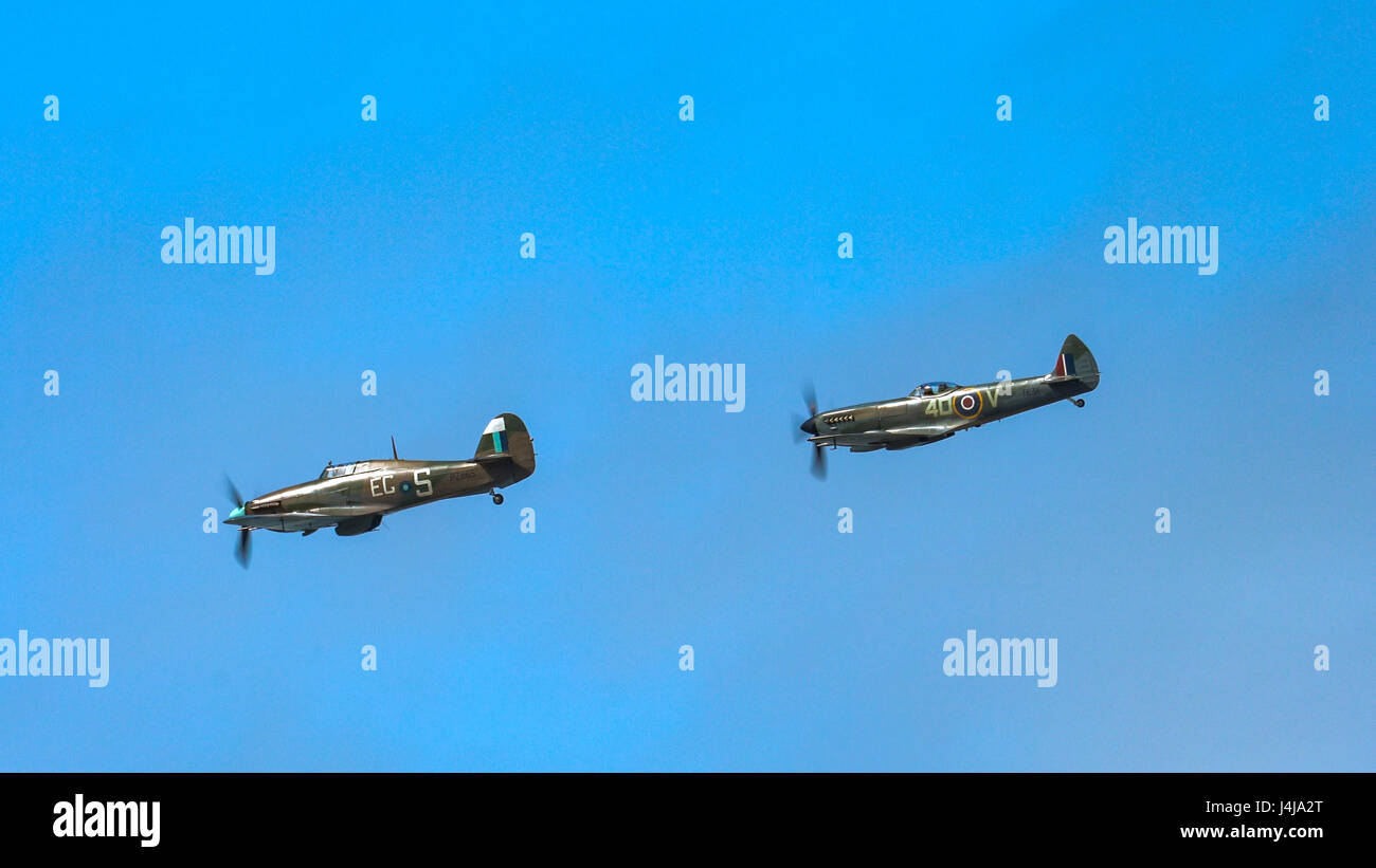 A flypast from a Spitfire and Hurricane from the Battle of Britain Memorial Flight at the 2016 Rhyl Air Show Stock Photo