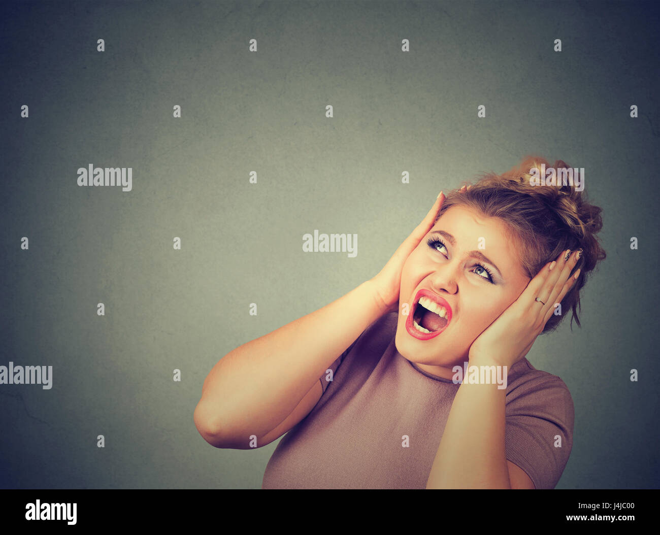 Stressed frustrated woman covering her ears with hands Stock Photo Alamy
