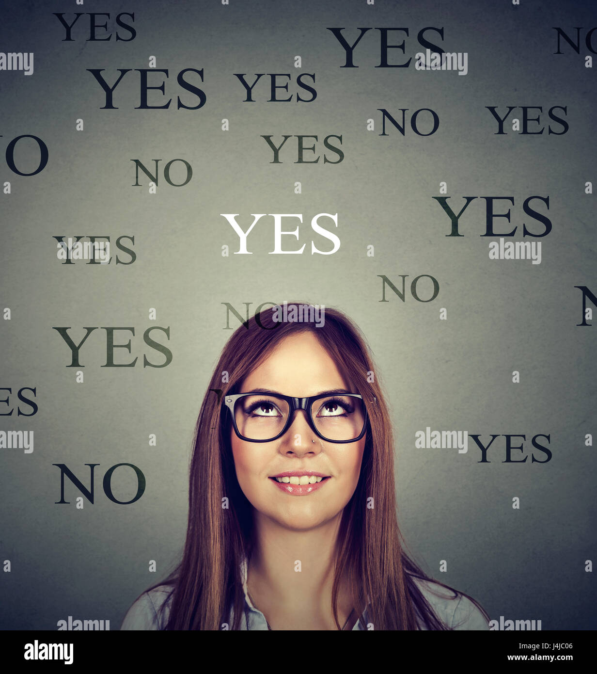 Young woman thinking yes or no Stock Photo