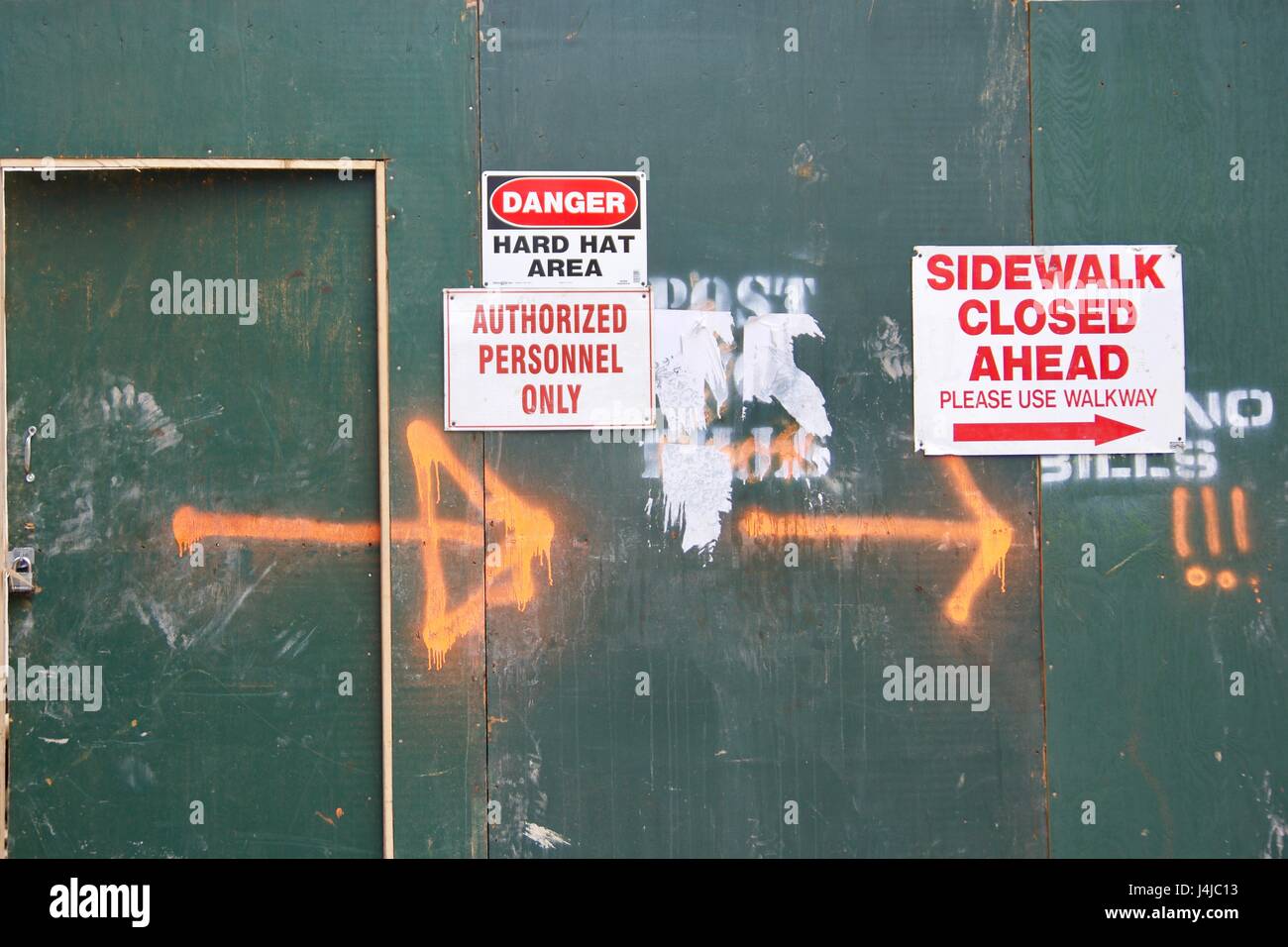 sidewalk closed danger signs symbol on urban city wall Stock Photo