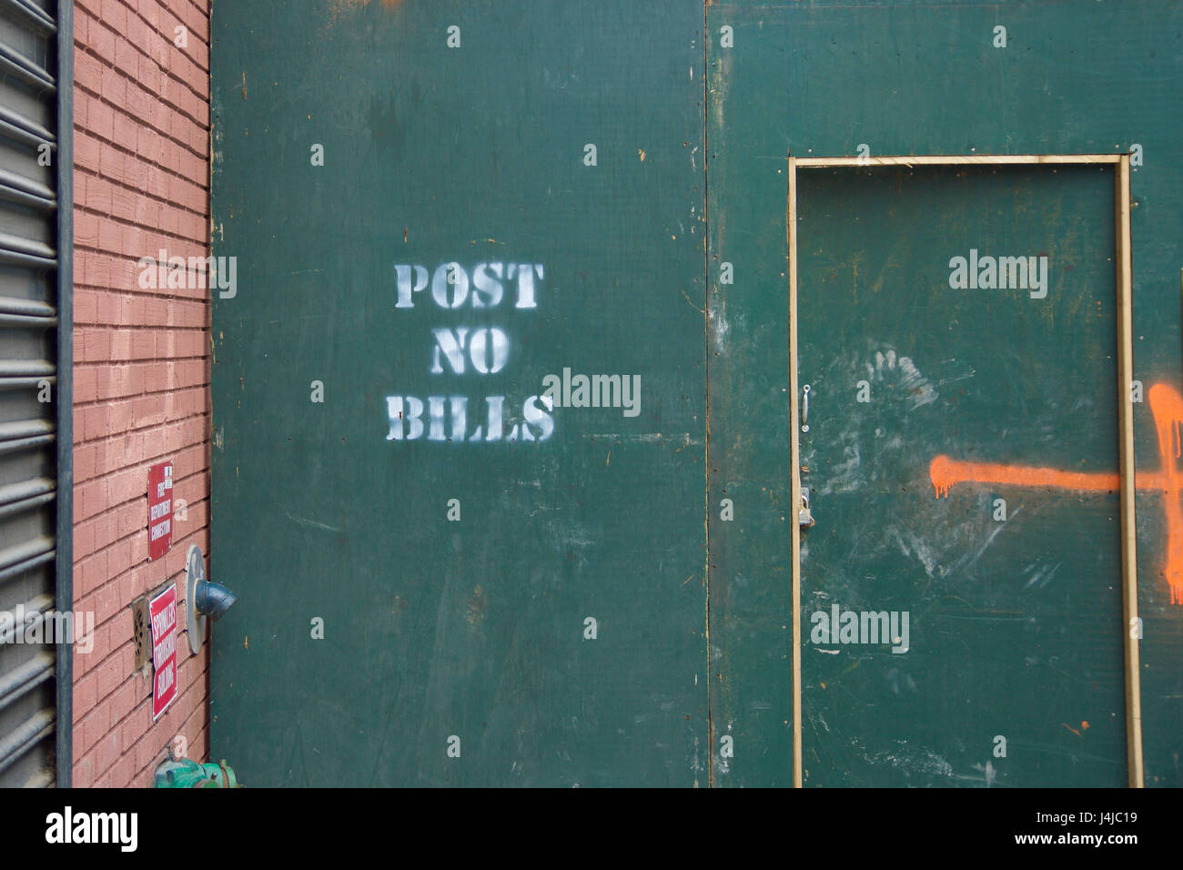 post no bills sign symbol on construction urban wall Stock Photo