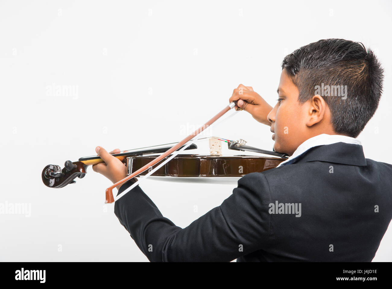 Cute little Indian/asian boy playing violin like a professional