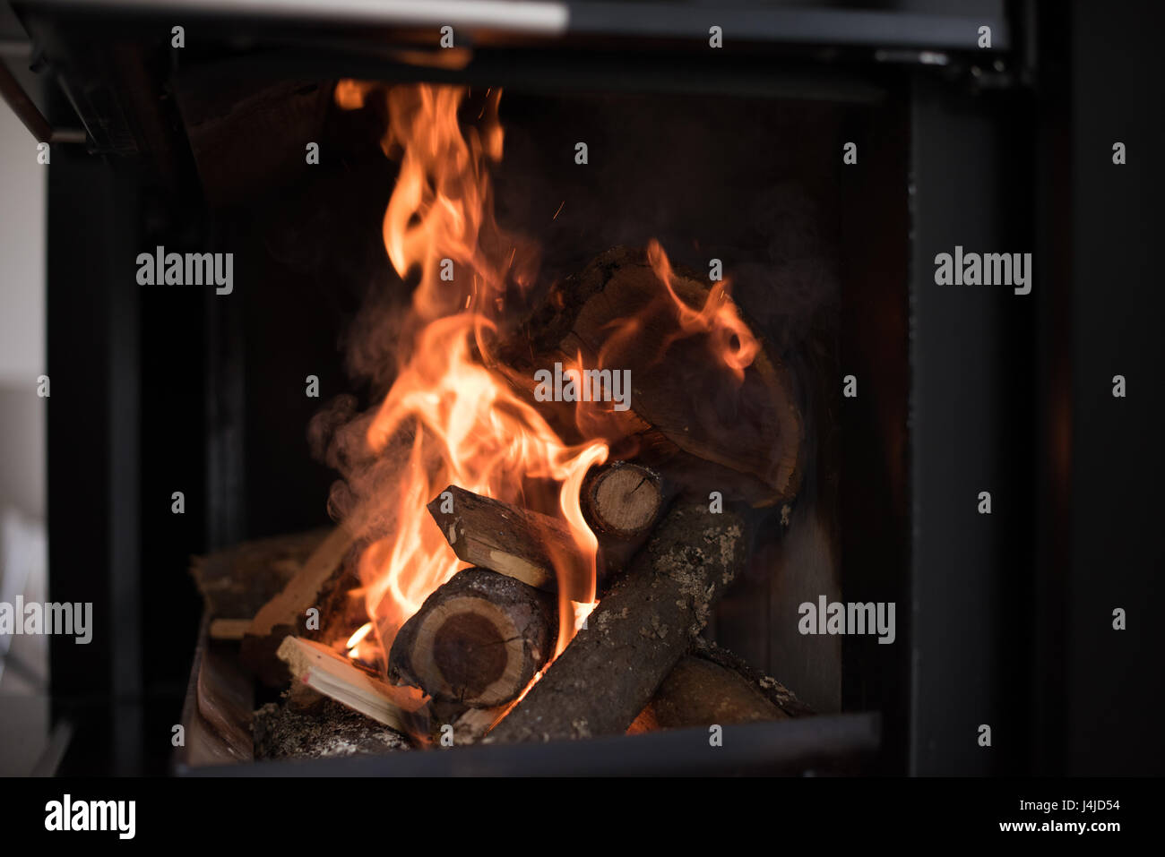 Beautiful flame fireplace. Wood burning bright flames in a modern ...