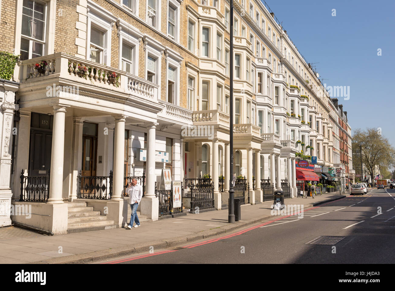 Cromwell Road, South Kensington, London, UK. With restored Victorian terraced houses and local businesses. Cromwell Road is a major road in the exclus Stock Photo
