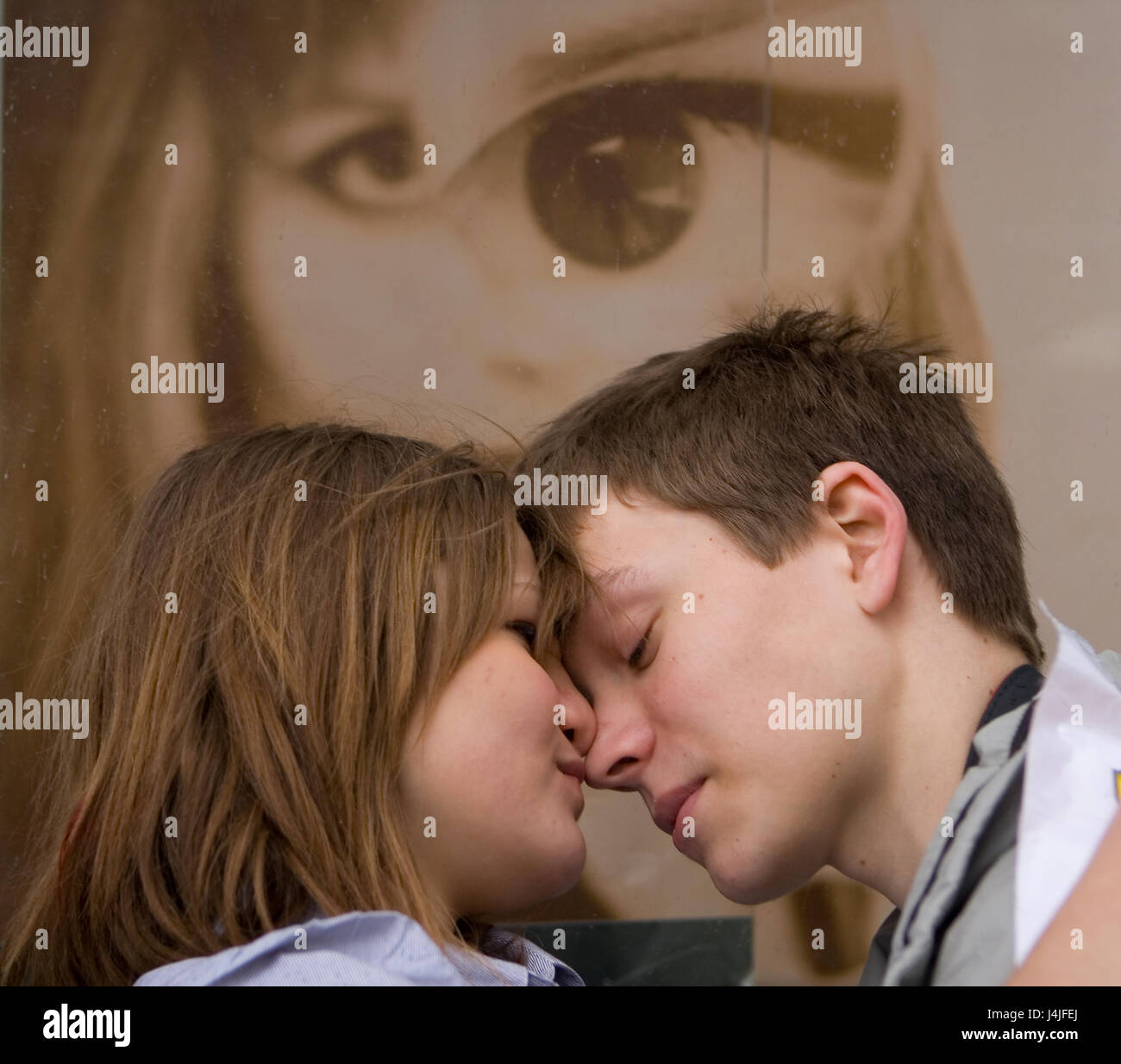 Moscow, Russia, April 10, 2011: Enamoured young man and woman embracing on the street. Stock Photo