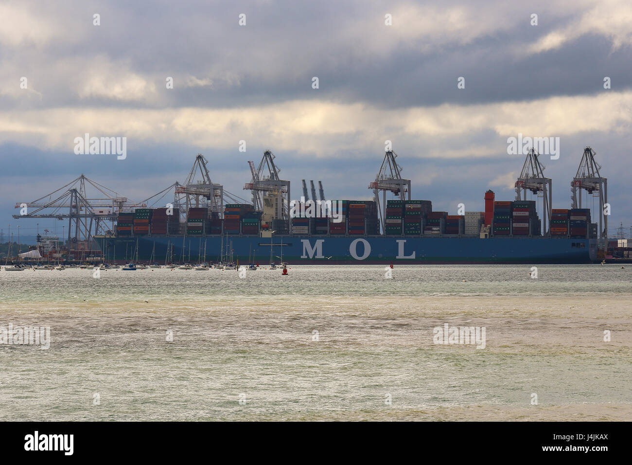 The worlds second largest container ship, MOL Triumph sits in Southampton Docks. Stock Photo