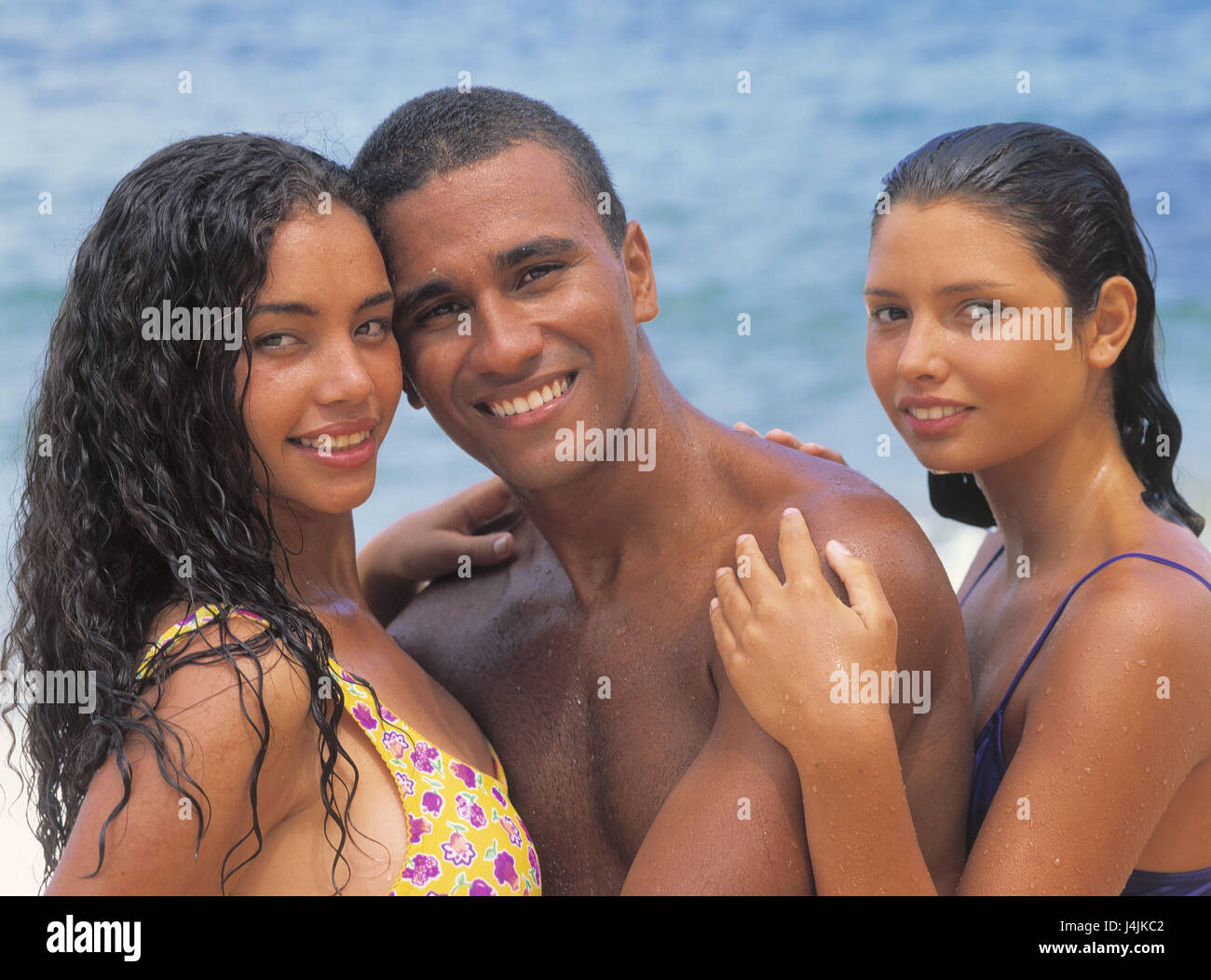 Brazil, beach, sea, man, women, two, swimwear, wet, embrace, half portrait  America, South America, Brazilian, Brazilian, young, colourfully,  non-whites, non-white, Mulatte, Mulattin, swimsuit, bikini, smile, there  falls in love, touch, water, vacation