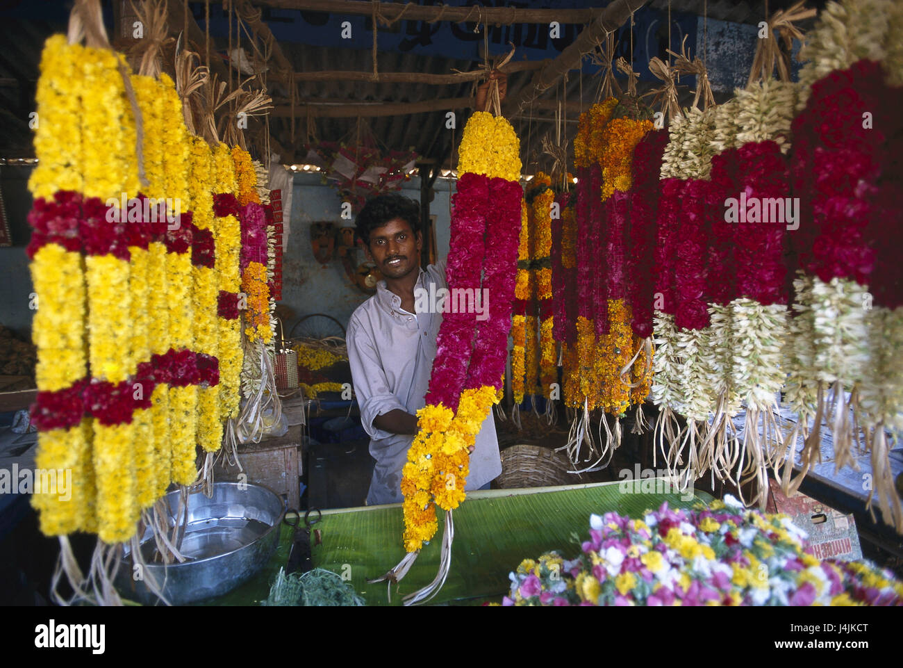 India, Tamil Nadu, Thanjavur, flower market, seller, garlands, no model release! Asia, South