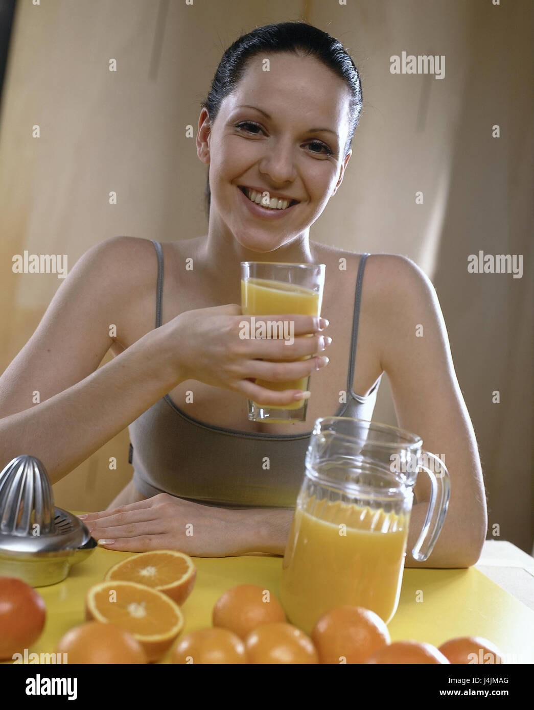 Woman, orange juice, half portrait inside, young, sit, decanter