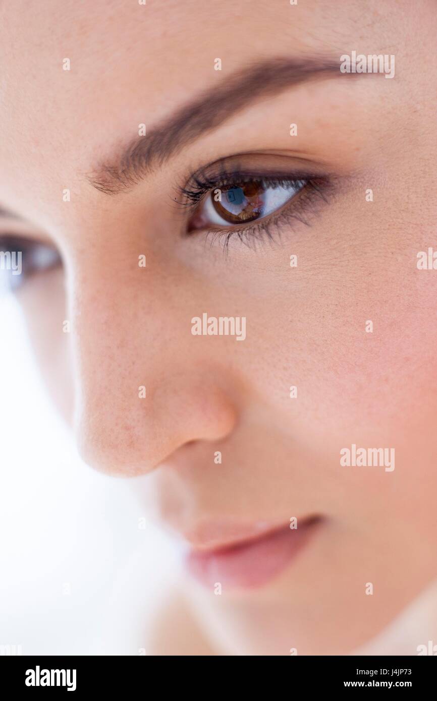 Young woman with brown eyes, close up portrait. Stock Photo