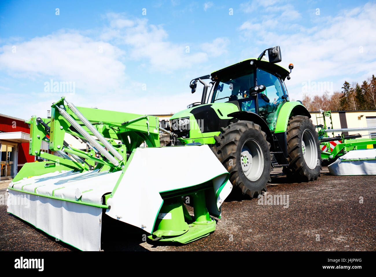 Tractor with mower Stock Photo Alamy