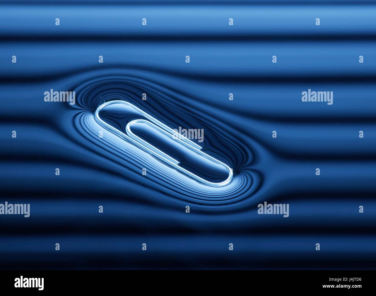 Paperclip floating on the water surface Stock Photo Alamy