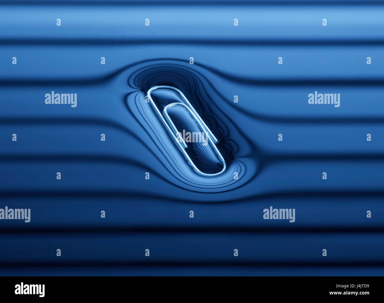 Paperclip floating on the water surface Stock Photo Alamy