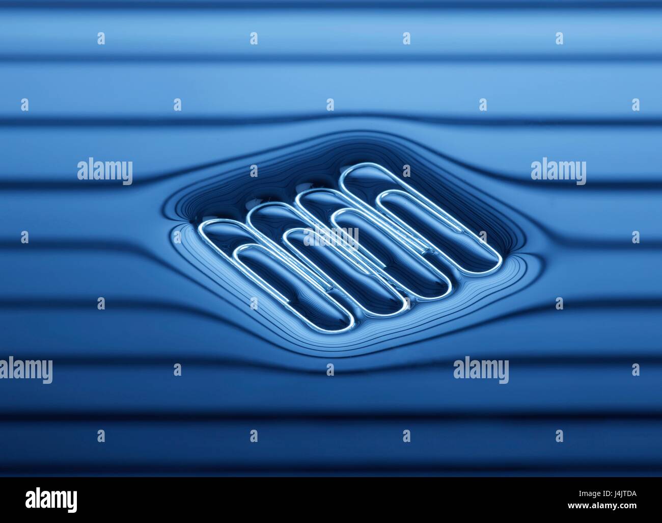 Four paperclips floating on the water surface Stock Photo Alamy