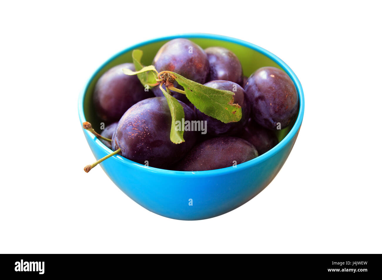 plums in bowl isolated Stock Photo