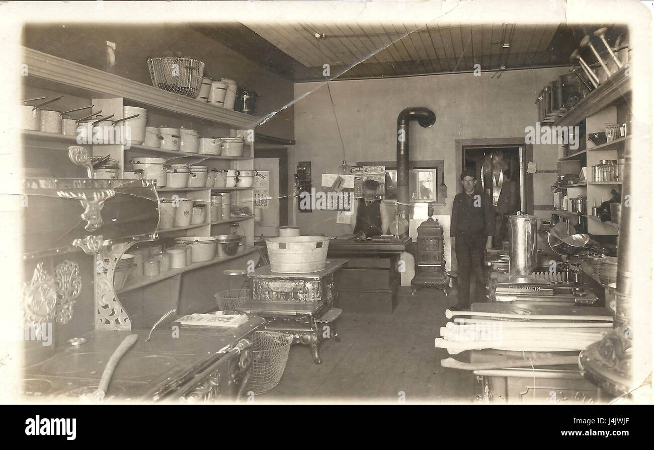 Photo postcard showing the interior of a store selling kitchen equipment hires stock