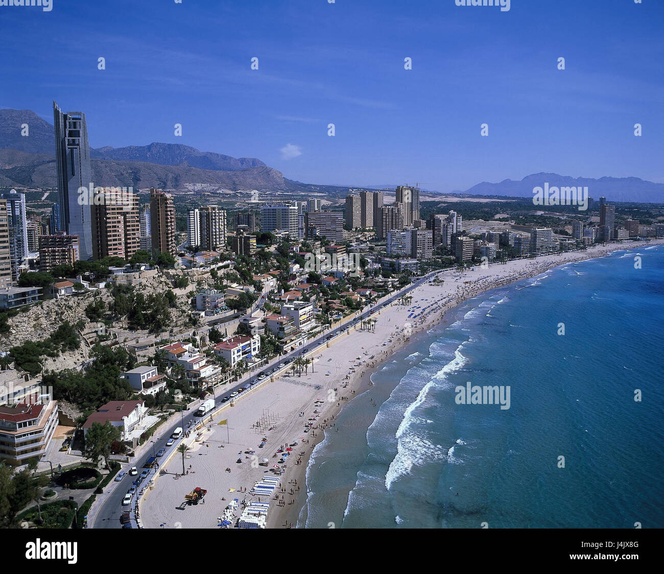 Spain, Costa Blanca, region Valencia, Benidorm, town view, beach outside, province Alicante, town, view, houses, high rises, hotels, seaside resort, resort, holiday destination, tourism, tourist resort, coast, sandy beach, beach, sea, bathers, tourism Stock Photo