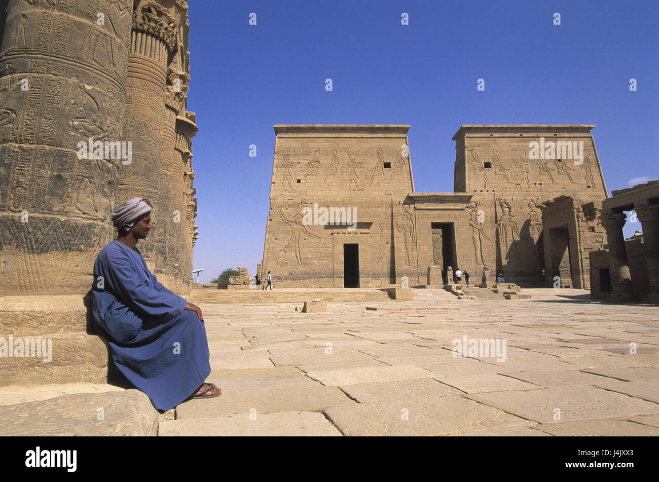 Egypt, Nubia, Aswan, Agilika, Isis temple, man, sit no model release outside, Africa, East, Aswan, island, reservoir, art, culture, place of interest, temple, Isis, Philae, UNESCO-world cultural heritage, 1st pylon, gate, goal attachment Stock Photo