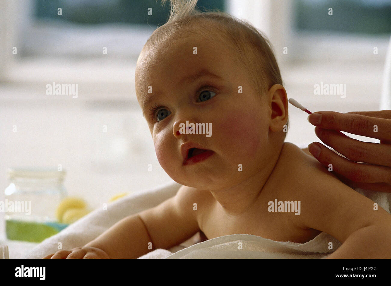Compress table, mother, cotton bud, baby, abdominal position, portrait