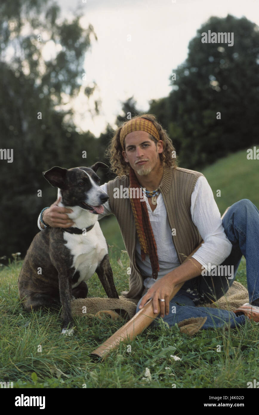 Meadow, man, young, dog, friendship summer, leisure time, animal-loving, animal-loving, dogs, pet, pets, mammal, mammals, walk, dog position, sit, meadow, touch, suture, protection, trust Stock Photo