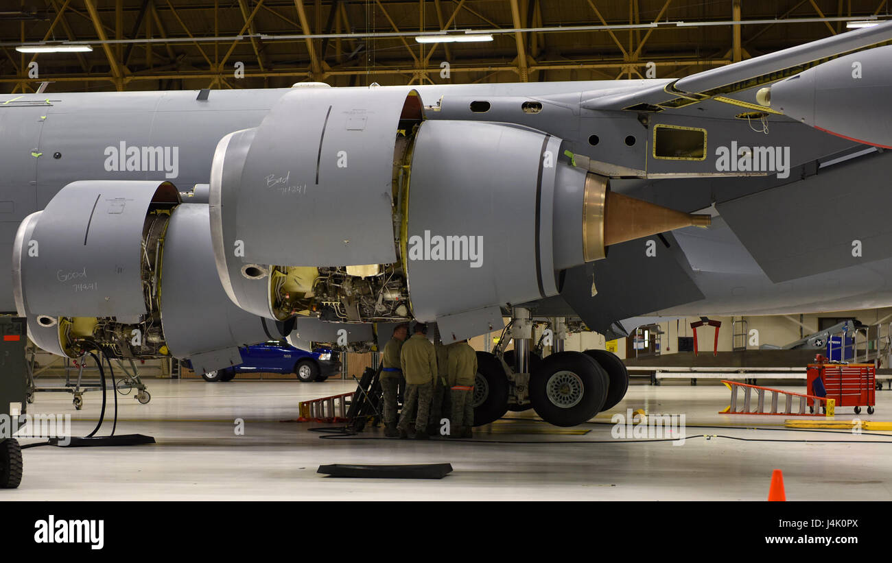 Airmen from the 92nd Maintenance Squadron work together to check on the