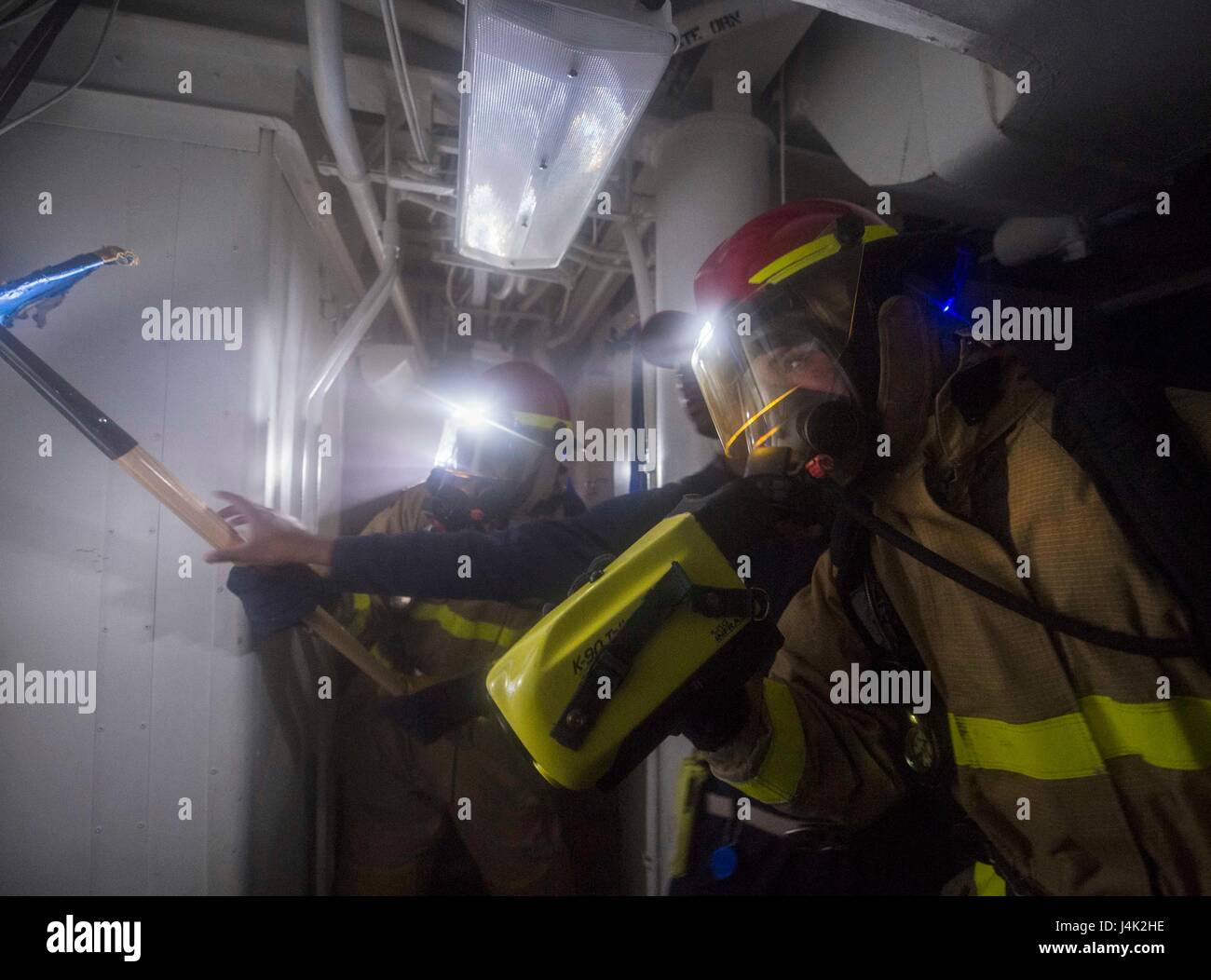 Navy personnel conduct routine duties in a professional operational ...