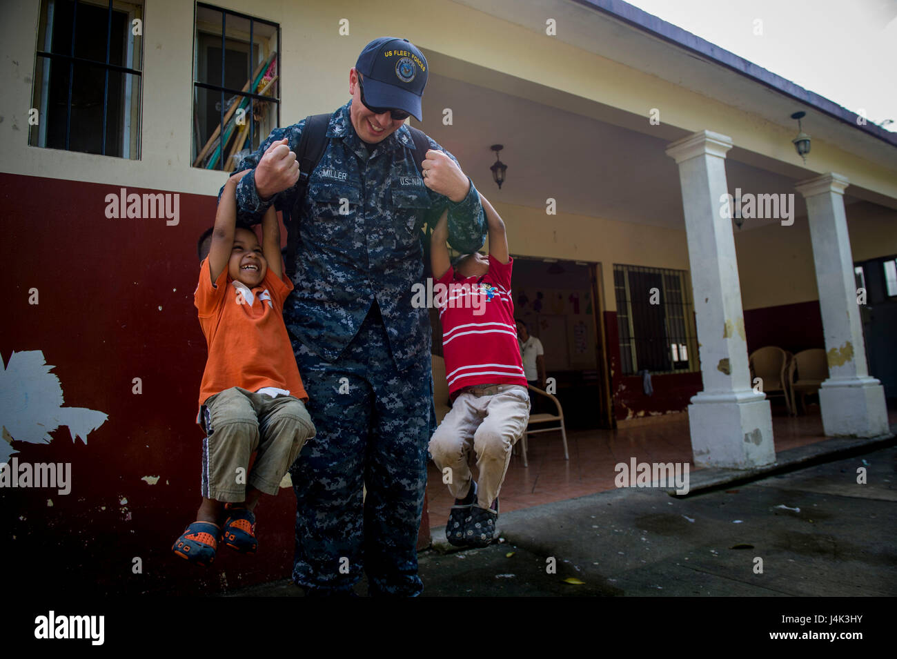 170206-N-YL073-041   PUERTO BARRIOS, Guatemala (Feb. 6, 2017) Musician 3rd Class Ryan Miller, assigned to U.S. Fleet Forces Band, plays with host nation children during a visit to an orphanage in support of Continuing Promise 2017 (CP-17) in Puerto Barrios, Guatemala. CP-17 is a U.S. Southern Command-sponsored and U.S. Naval Forces Southern Command/U.S. 4th Fleet-conducted deployment to conduct civil-military operations including humanitarian assistance, training engagements, and medical, dental, and veterinary support to Central and South America. (U.S. Navy photo by Mass Communication Specia Stock Photo