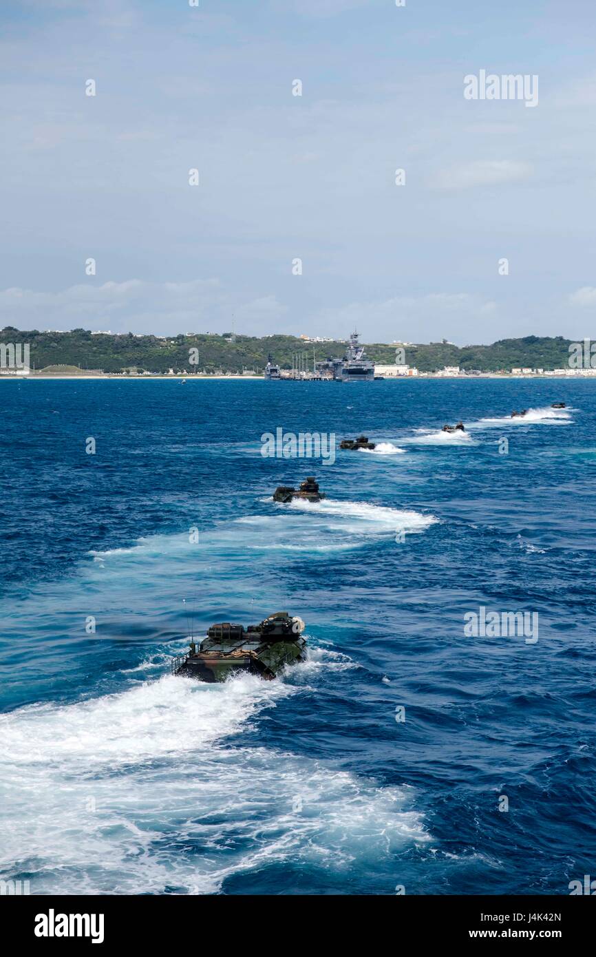 170305-N-JH293-071 BUCKNER BAY, Okinawa (March 5, 2017) Amphibious assault vehicles, assigned to the 31st Marine Expeditionary Unit (MEU), depart the well deck of the amphibious transport dock ship USS Green Bay (LPD 20) off the coast of Okinawa, Japan. Green Bay, with embarked 31st MEU, is on a routine patrol, operating in the Indo-Asia-Pacific region to enhance partnerships and be a ready-response force for any type of contingency. (U.S. Navy photo by Mass Communication Specialist 1st Class Chris Williamson/Released) Stock Photo